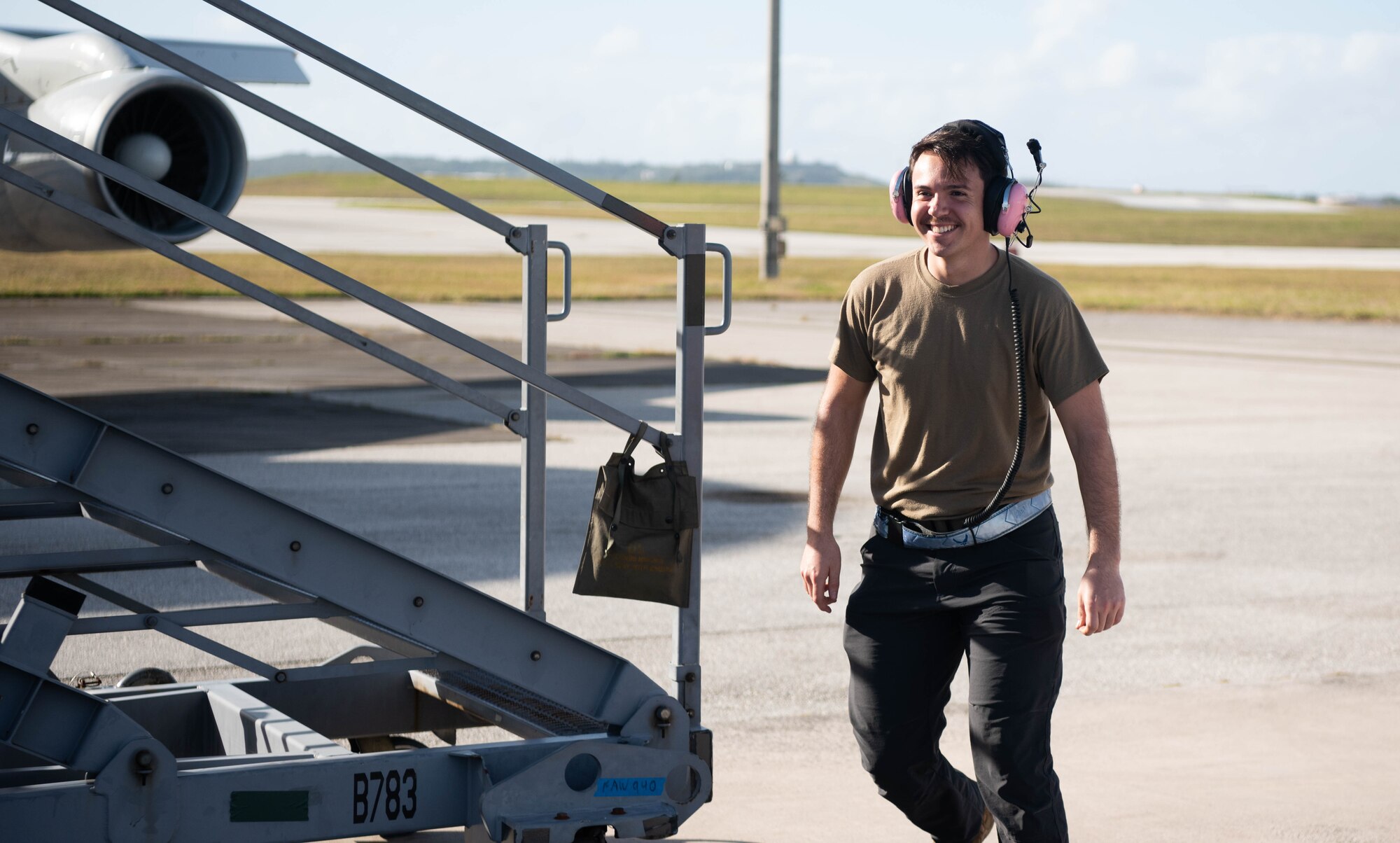 An Airman conducts pre-flight procedures.