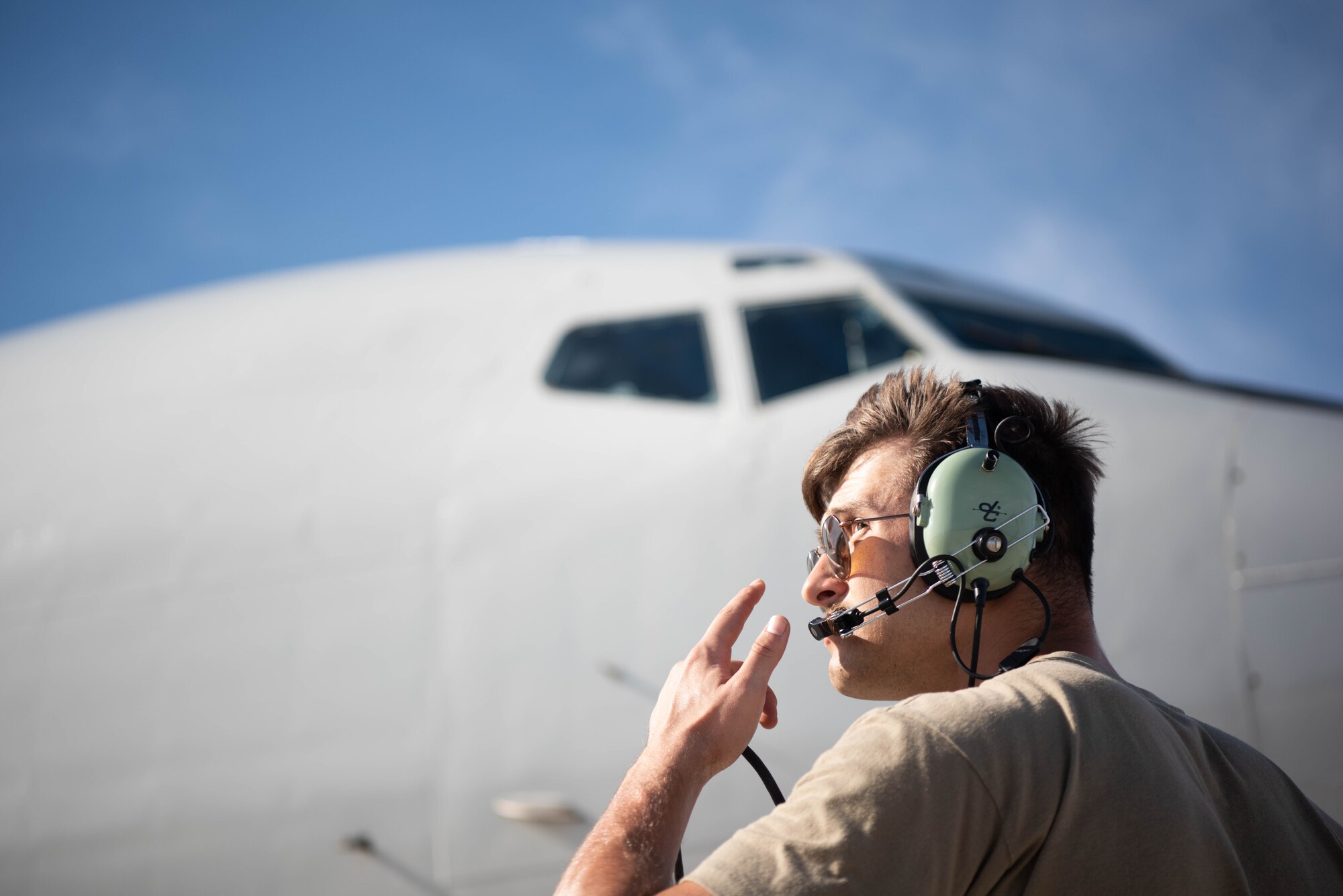 An Airman conducts pre-flight procedures.
