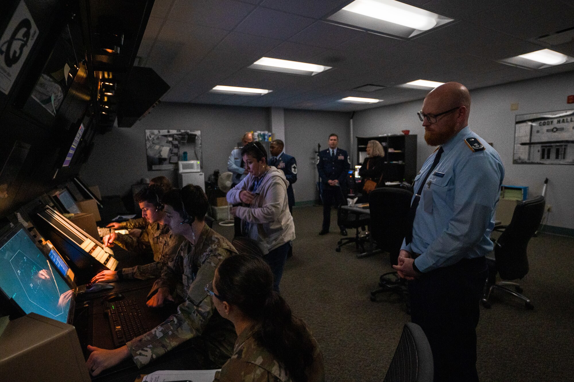 A Member of the German Military Aviation Authority observes students assigned to the 334th Training Squadron working in the simulated radar control room on Keesler Air Force Base, Mississippi, Feb. 12, 2024.