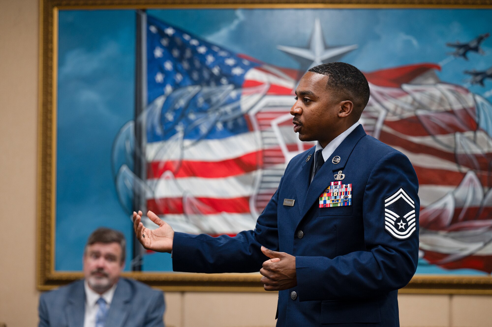 U.S. Air Force Senior Master Sgt. Andre Heags, 334th Training Squadron air traffic control training superintendent, briefs members of the German Military Aviation Authority on Keesler Air Force Base, Mississippi, Feb. 12, 2024.