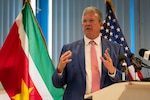 Robert Faucher, U.S. Ambassador to Suriname, provides remarks during an opening ceremony for the Lesser Antilles Medical Assistance Team in Paramaribo, Suriname, Feb. 19, 2024. This is the second iteration of the LAMAT mission to Suriname, where ready-medics will work alongside partner nation military and civilian health teams to achieve mutual benefits and build trust in the region. (U.S. Air Force photo by Tech. Sgt. Rachel Maxwell)