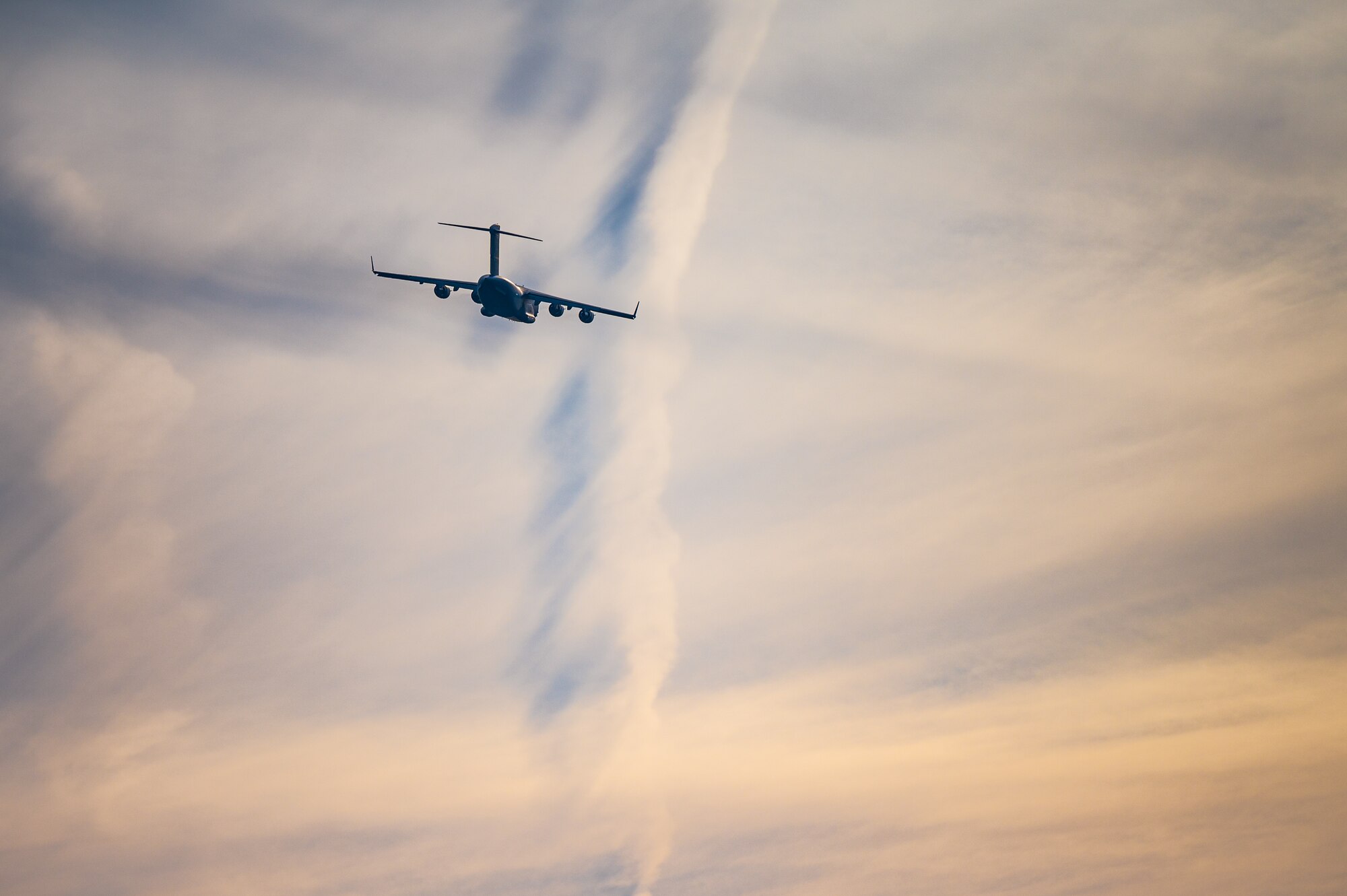 A C-17 Globemaster III assigned to the 305th Air Mobility Wing, conducts touch-and-go landing tactics on a taxiway during the Tactics Advancement Course at Joint Base McGuire-Dix-Lakehurst, Feb. 8, 2024. Airmen assigned to the 6th Airlift Squadron loaded cargo onto the C-17 to support F-22 Raptors at JBLE. The advancements course postures Air Mobility Command Airmen to execute agile operations on a global scale. (U.S. Air Force photo by Senior Airman Sergio Avalos)
