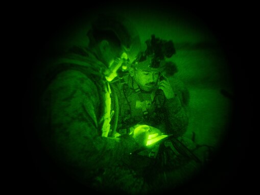 U.S. Marines Sgt. Heriberto Rayescandelario, a data systems administrator, left, and Cpl. Christian Montemayor, a fire support Marine, right, both with 5th Air Naval Gunfire Liaison Company, III Marine Expeditionary Force Information Group, conduct a notional 5-line close air support mission during a communications field exercise, Rapid Tanto at Ie Shima, Okinawa, Japan, Feb. 6, 2024. The exercise allowed Marines to conduct communications training to include 9-line casualty evacuation requests with field radios. Using off-the-shelf radars and low-signature equipment, 5th ANGLICO and 3rd Intelligence Battalion demonstrated proficiency in planning, coordination, and execution of dynamic targeting capable of supporting maritime campaigns in an increasingly contested Indo-Pacific. Rayescandelario is a native of San Juan, Puerto Rico, and Montemayor is a native of San Diego. (U.S. Marine Corps photo by Cpl. William Wallace)