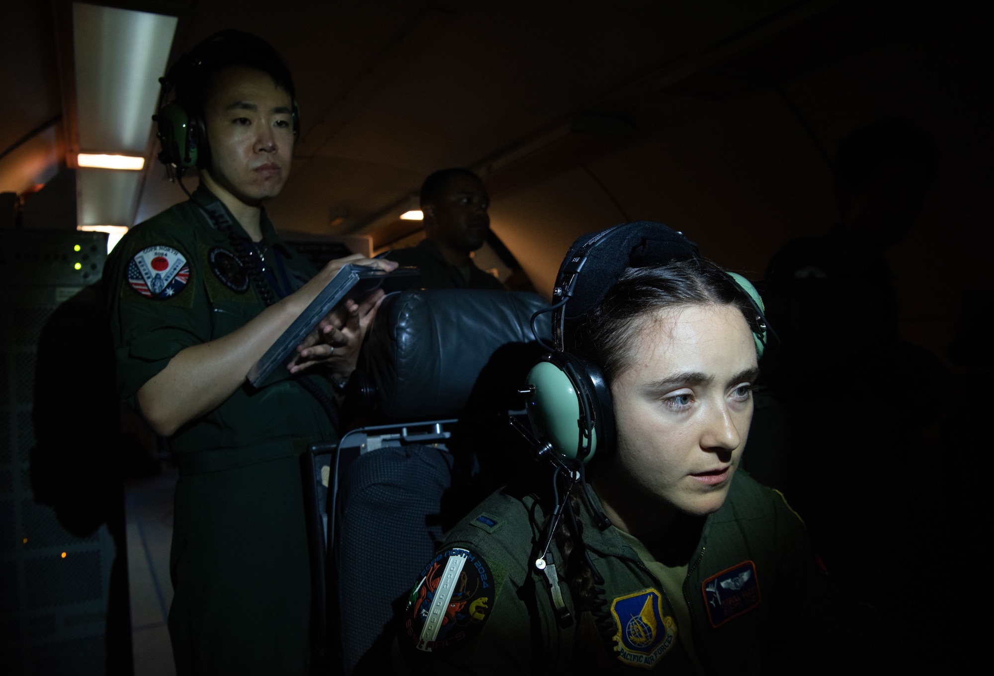 A JASDF ABM watches a USAF ABM work.