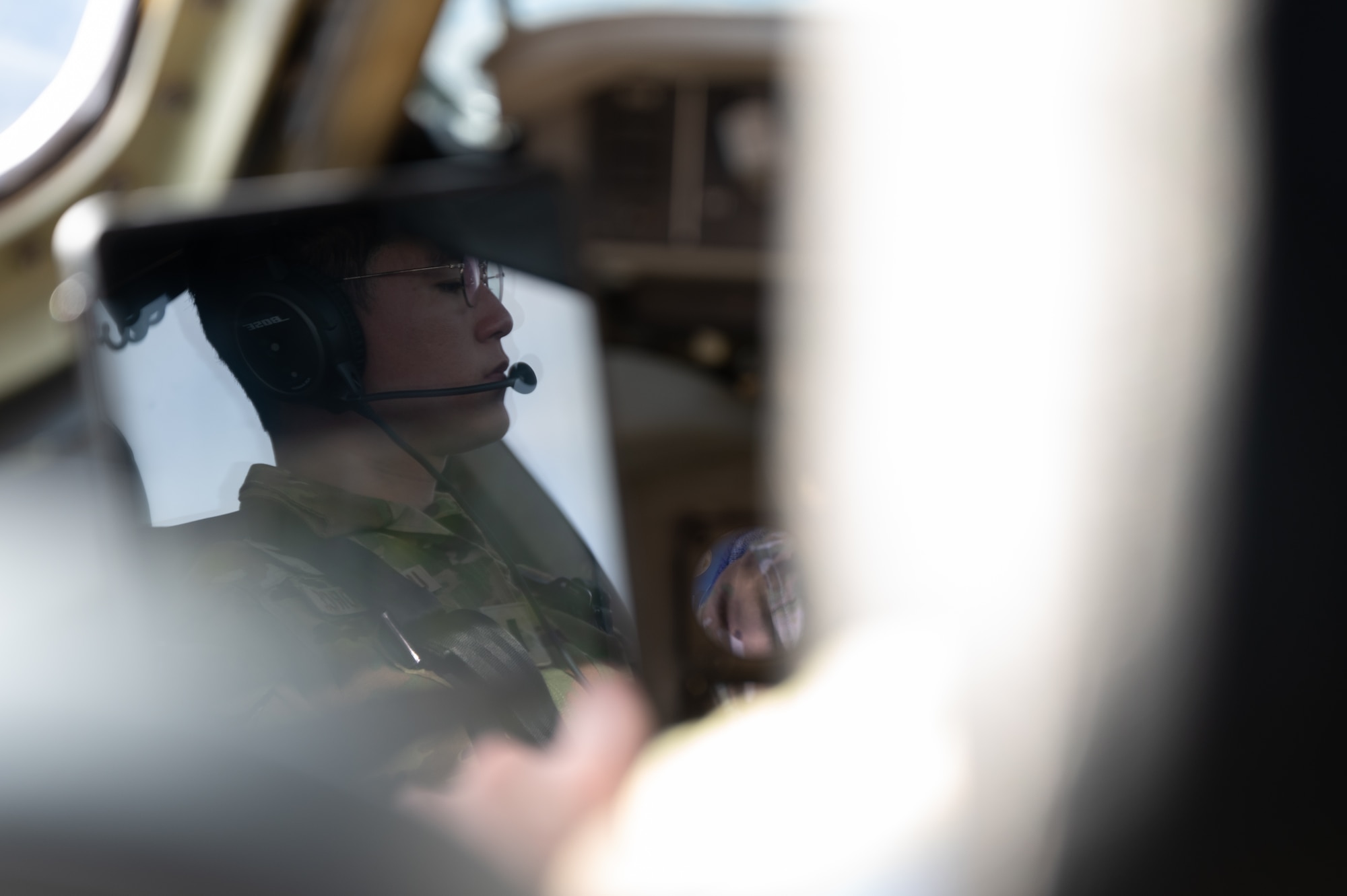 U.S. Air Force 1st Lt. Seung Woo Ban, 6th Airlift Squadron C-17 pilot, flies a C-17 Globemaster III during the Tactics Advancement Course at Joint Base Langley-Eustis, Va., Feb. 7, 2024. Airmen assigned to the 6th Airlift Squadron loaded cargo onto the C-17 in order to provide support for the F-22 Raptors at JBLE. The advancements course postures Air Mobility Command Airmen to execute agile operations on a global scale. (U.S. Air Force photo by Airman 1st Class Aidan Thompson)