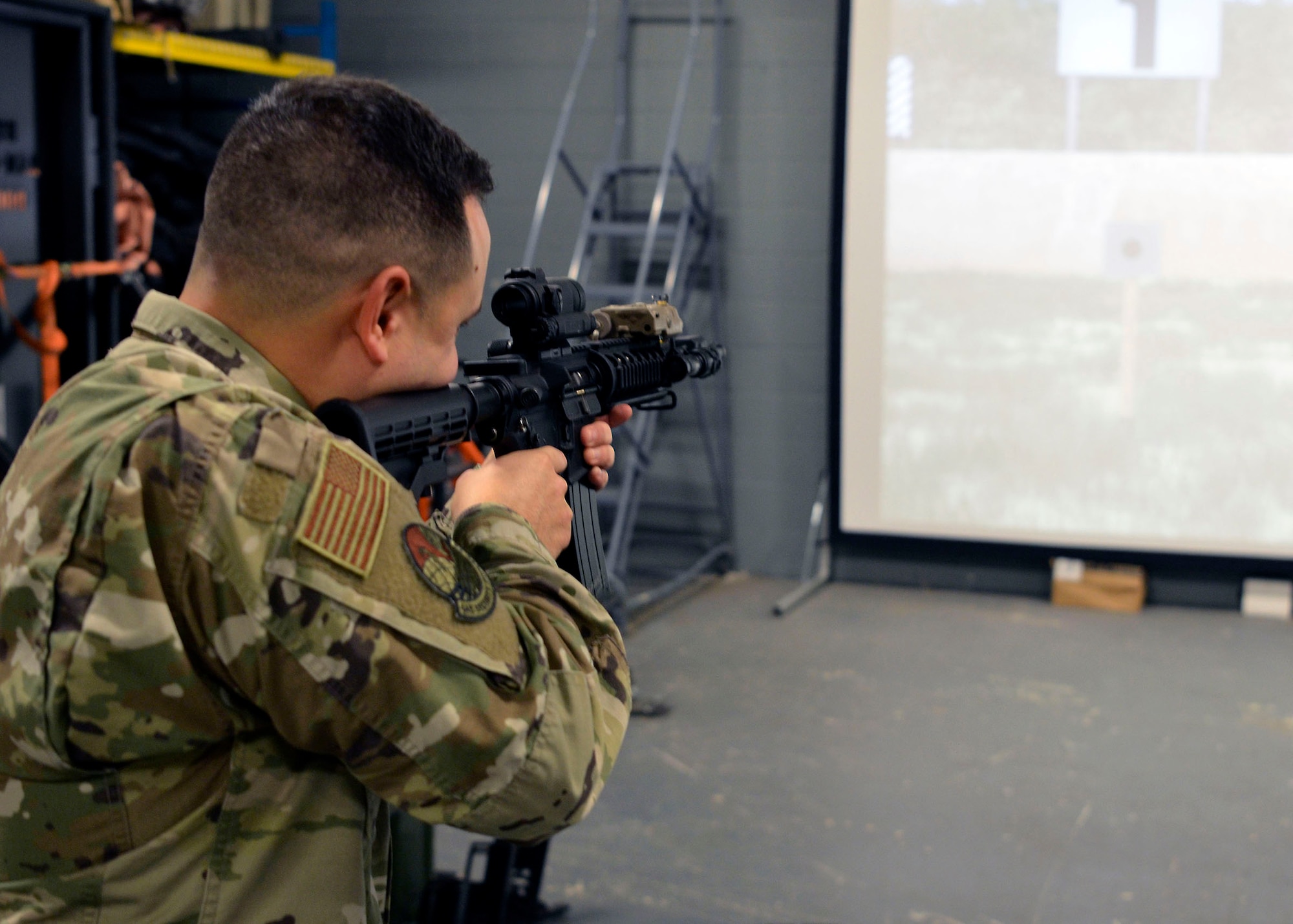 Staff Sgt. Tyler Acevedo, 445th Security Forces Squadron fire team leader, engages targets during virtual marksmanship training at Wright-Patterson Air Force Base, Ohio, Jan. 6,
2024. (U.S. Air Force photo/Staff Sgt. Ethan Spickler)