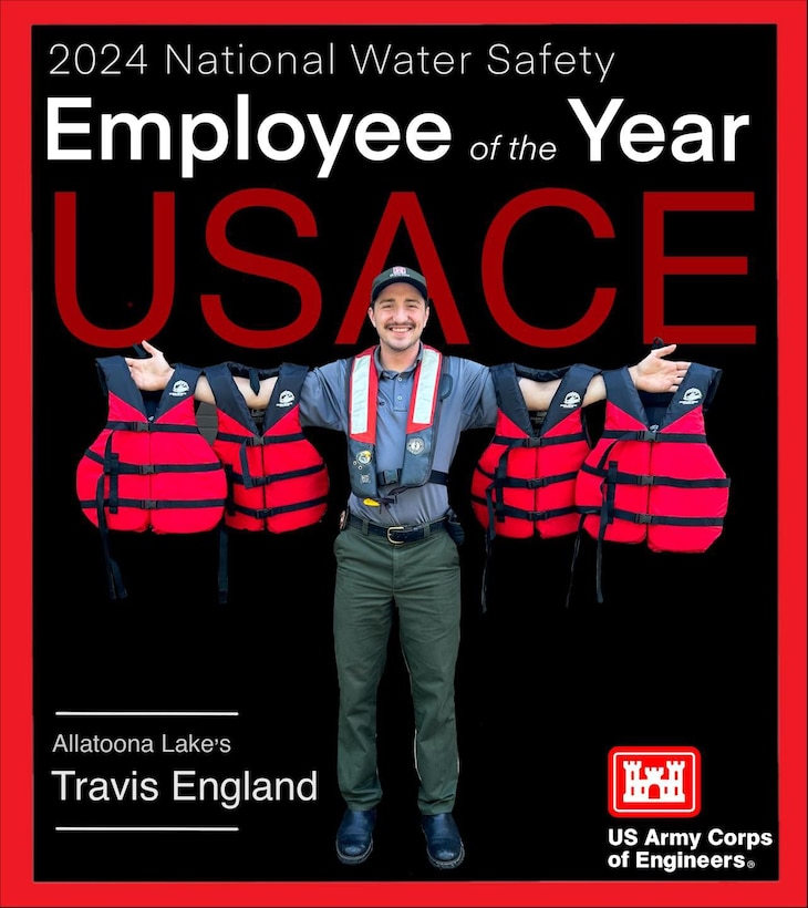 Smiling park ranger holding up 4 red life jackets.