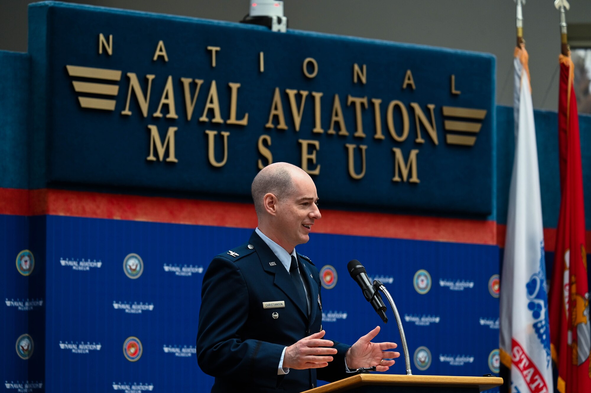 U.S. Air Force Col. John Christianson, 350th Spectrum Warfare Wing deputy commander, delivers the keynote address during the Undergraduate Combat Systems Officers Course graduation ceremony at the National Naval Aviation Museum, Naval Air Station Pensacola, Fla., Feb. 16, 2024. Combat System Operators are humans-on-the-loop synchronizing diverse technologies; ingrained with the inherent skills to sense, target, and attack from the air, the eyes and ears in the sky. (U.S. Air Force photo by Capt. Benjamin Aronson)
