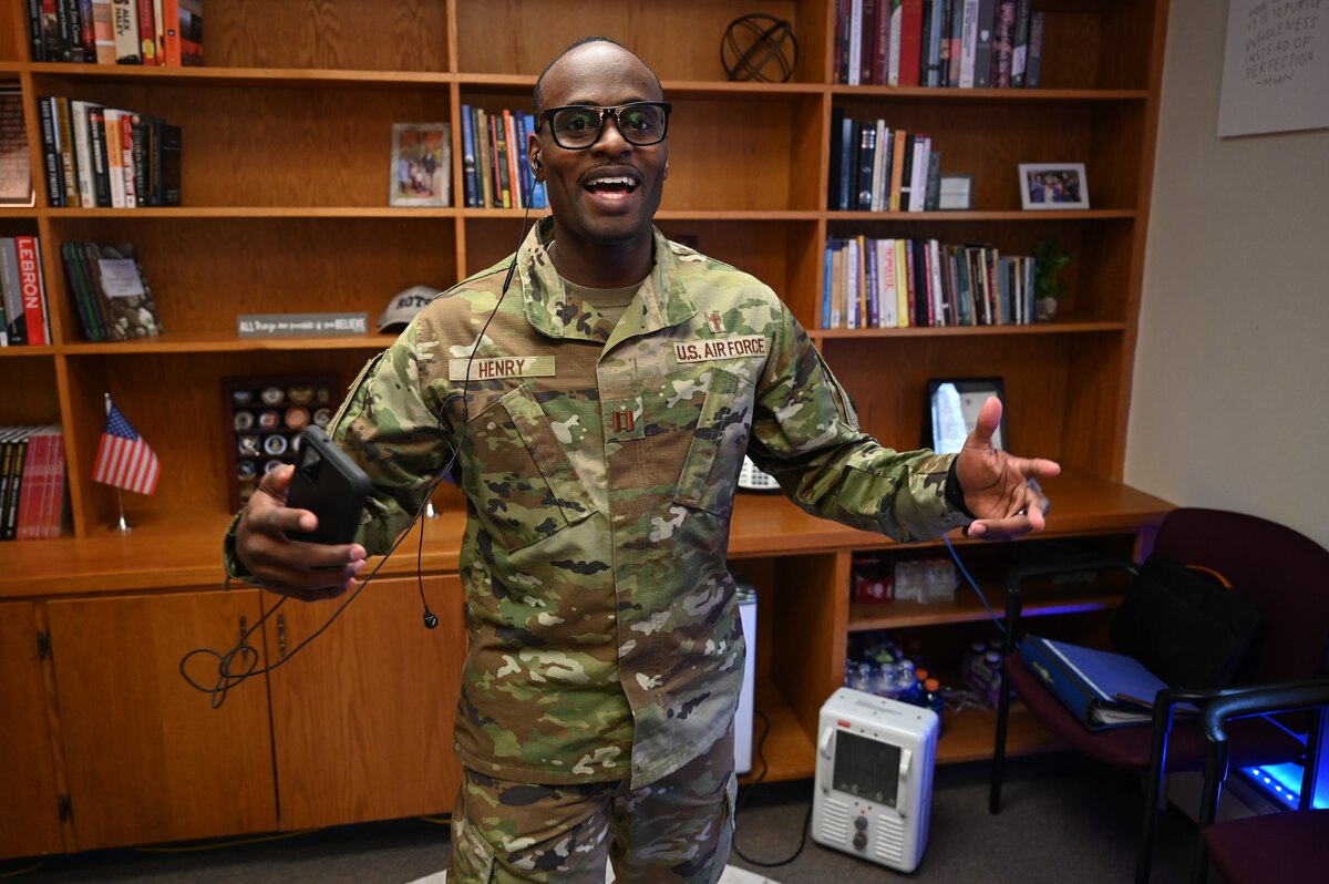 Image of a military chaplain practicing a song.