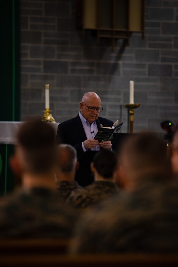 Ret. U.S. Navy commander Porter Halyburton reads his poetry aloud during a professional military education class on spiritual resiliency on Marine Corps Air Station New River, in Jacksonville, North Carolina, Feb. 13, 2024. Halyburton survived seven-and-a-half years in captivity as a Prisoner of War in North Vietnam during the Vietnam War and talks about the wisdom and liberation from his harrowing experience. (U.S. Marine Corps photo by Lance Cpl. Loriann Dauscher)