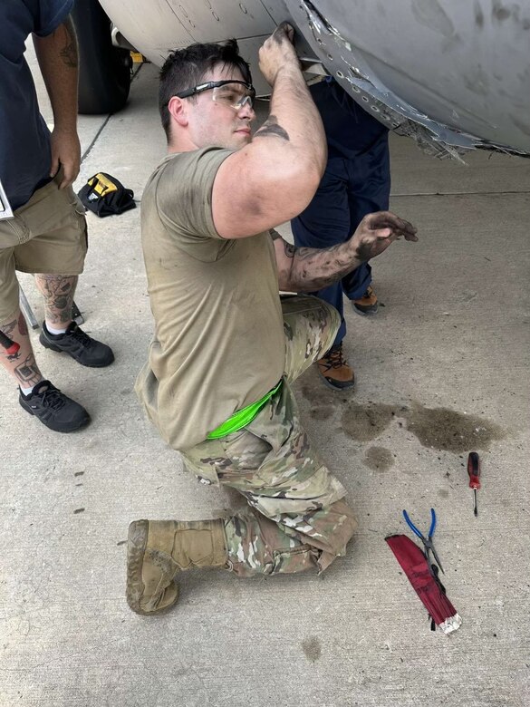 A U.S. Air Force Airmen assigned to the 305th Maintenance Squadron repairs damage on a C-17 Globemaster III at Naval Station Norfolk, Va., July 2023. Maintainers from the 305th MXS completed a five-month fabrication project for a damaged C-17, reaffirming Air Mobility Command’s strategic advance and rapid global mobility. (U.S. Air Force photo by 2nd Lt. Alexis Kula)