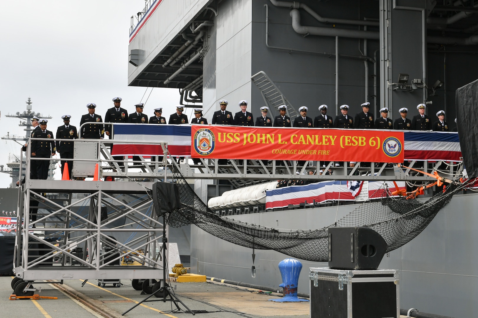 The crew of the expeditionary sea base USS John L. Canley (ESB 6) mans the ship during its commissioning ceremony on Naval Base Coronado Feb. 17, 2024.