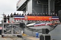 The crew of the expeditionary sea base USS John L. Canley (ESB 6) mans the ship during its commissioning ceremony on Naval Base Coronado Feb. 17, 2024.