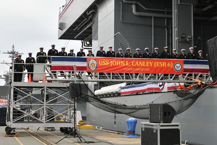 The crew of the expeditionary sea base USS John L. Canley (ESB 6) mans the ship during its commissioning ceremony on Naval Base Coronado Feb. 17, 2024.