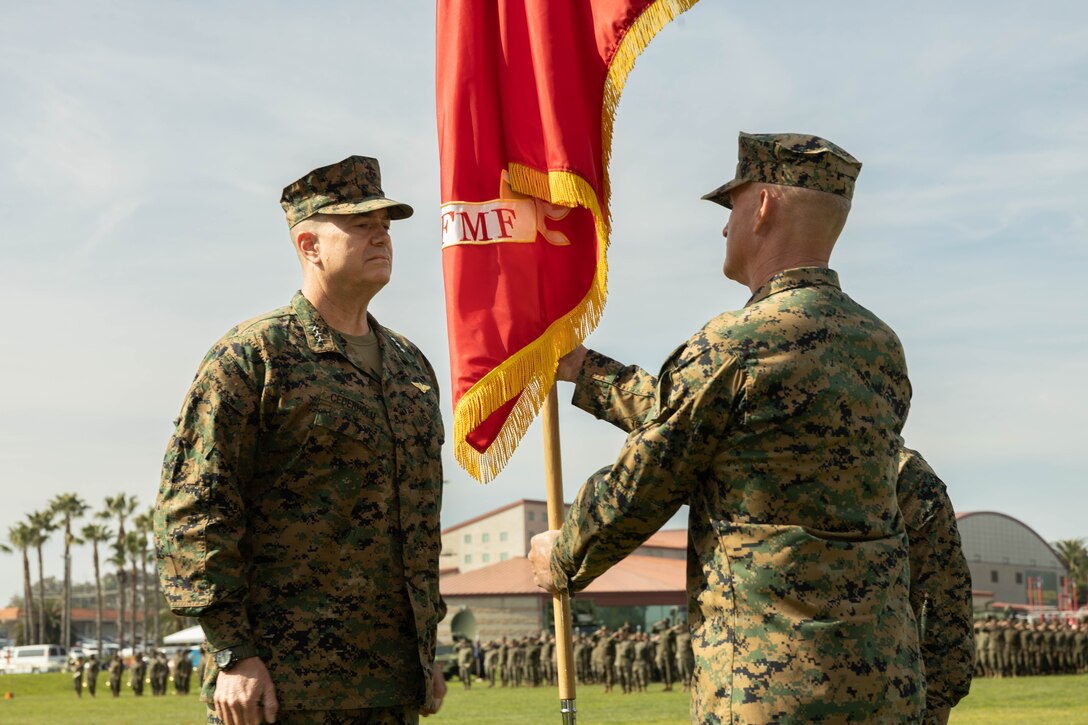 U.S. Marine Corps Maj. Gen. Bradford J. Gering, outgoing commanding general of I Marine Expeditionary Force, right, presents the I MEF organizational colors to U.S. Marine Corps Lt. Gen. Michael S. Cederholm, incoming commanding general of I MEF, during the I MEF change of command ceremony at Marine Corps Base Camp Pendleton, California, Feb. 16, 2024. Maj. Gen. Bradford J. Gering relinquished command of I MEF to Lt. Gen. Michael S. Cederholm. I MEF provides the Marine Corps a globally responsive, expeditionary, and fully scalable Marine Air-Ground Task Force, capable of generating, deploying, and employing ready forces and formations for crisis response, forward presence, major combat operations, and campaigns. (U.S. Marine Corps photo by Cpl. Fred Garcia)