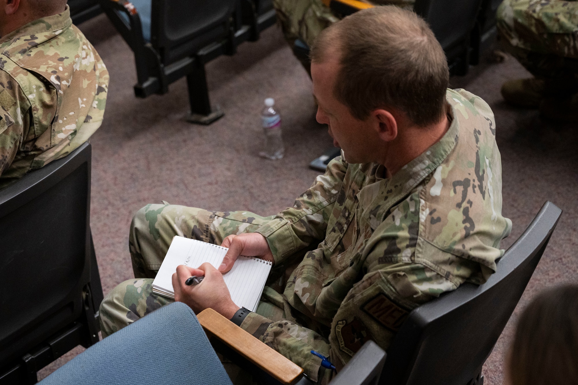 U.S. Air Force Tech. Sgt. Jason Zadnik, 47th Medical Logistics flight chief, takes notes during a Courageous Leadership Alliance seminar, Laughlin Air Force Base, Texas, Feb. 16, 2024. Team XL and North Carolina National Guard members participated in a two-day leadership development and organizational culture seminar, to learn about personal and professional tactics for challenges and improvements in the workplace. (U.S. Air Force photo by Senior Airman Kailee Reynolds)