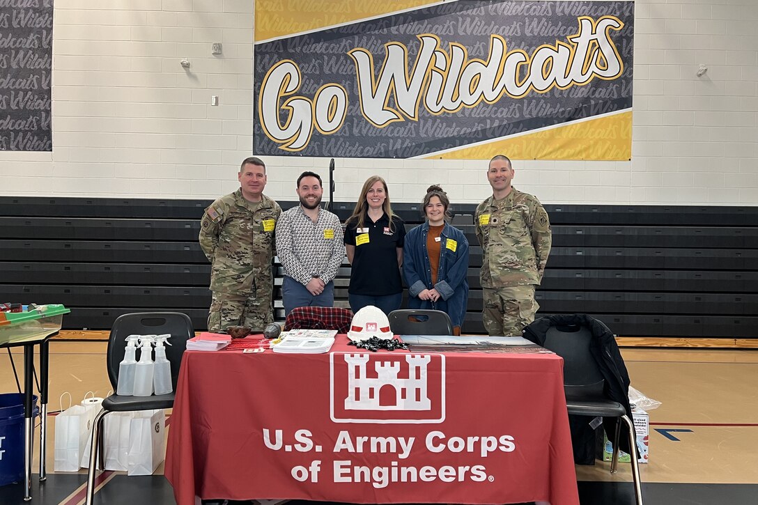 Members of the U.S. Army Corps of Engineers, Savannah District, pause for a photo at McAllister Elementary School’s Ninth Annual Career Day, in Richmond Hill, Georgia, Feb. 9, 2024. The Savannah District team met with students from second to fifth grade in the school’s gymnasium and educated them on the mission of the Savannah District and its contributions to infrastructure, archeology, flood control, and environmental restoration.