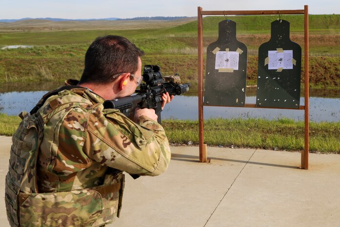 U.S. Air Force Capt. Dustin Fontenot, 427th Reconnaissance Squadron flight safety officer, fires an M4A1 Carbine during the shooting qualification of the Tactical Response Team (TRT) tryouts Feb. 12, 2024, at Beale Air Force Base, California.