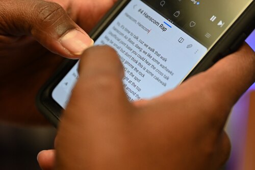 image of a song being read on a cellphone.