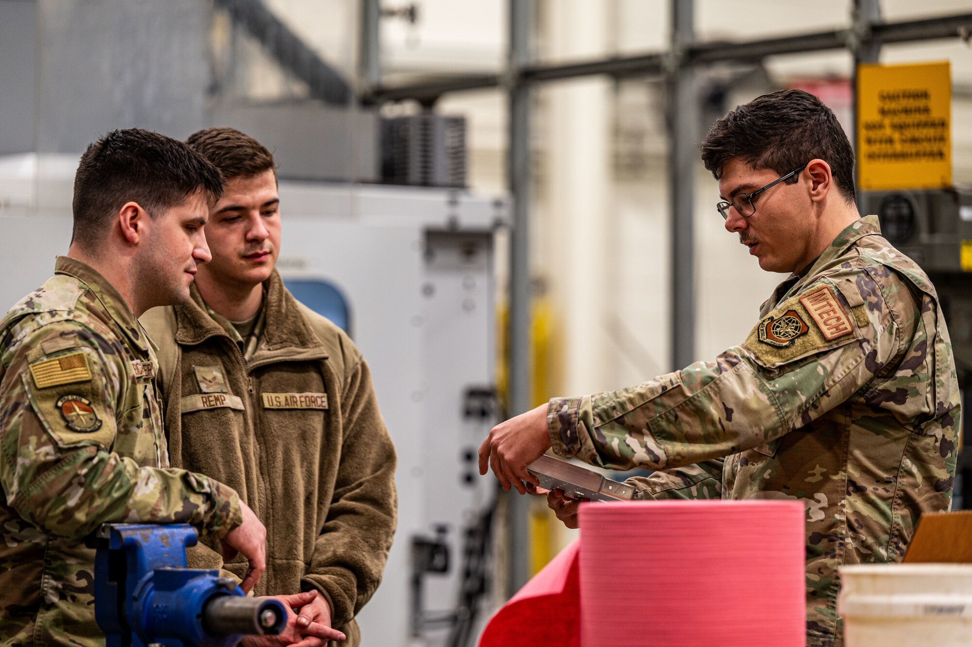 U.S. Air Force Airmen assigned to the 305th Maintenance Squadron discuss aircraft repair plans at Joint Base McGuire-Dix-Lakehurst, N.J., Feb. 15, 2024. Maintainers from the 305th MXS completed a five-month fabrication project for a damaged C-17 Globemaster III, reaffirming Air Mobility Command’s strategic advance and rapid global mobility. (U.S. Air Force photo by 2nd Lt. Alexis Kula)