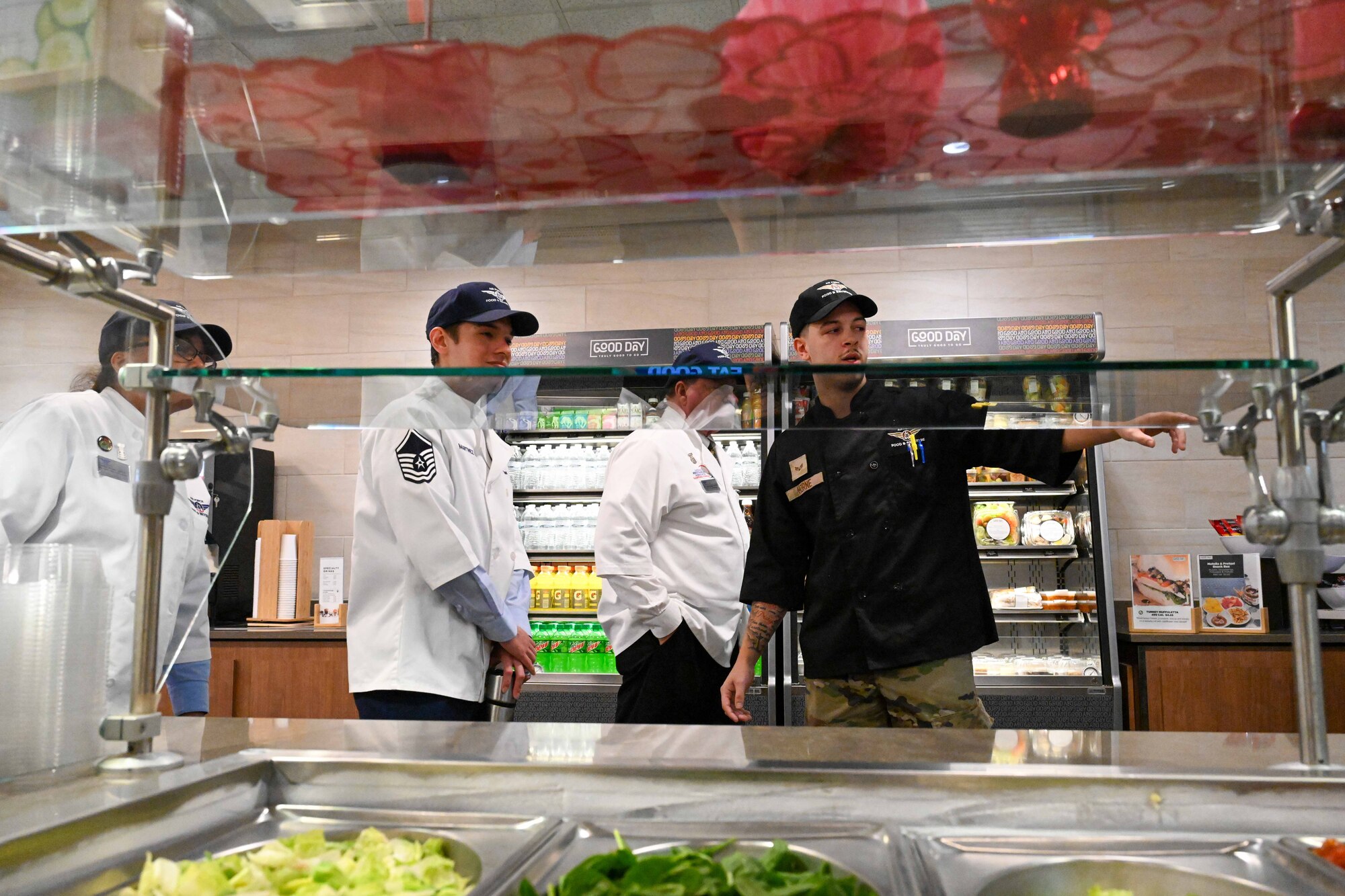 Hennesy Award critics inspect the Chisholm Dining Facility at McConnell Air Force Base, Kansas, Feb. 15, 2024. The Hennessy Award is an annual recognition given to the base with the best dining facility in the Air Force. (U.S. Air Force photo by Airman 1st Class William Lunn)