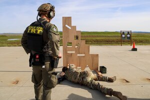 U.S. Air Force Senior Airman Noah Appelgren, 9th Reconnaissance Wing command post senior emergency actions controller, fires a Sig Sauer M18 during the shooting qualification of the Tactical Response Team (TRT) tryouts Feb. 12, 2024, at Beale Air Force Base, California.