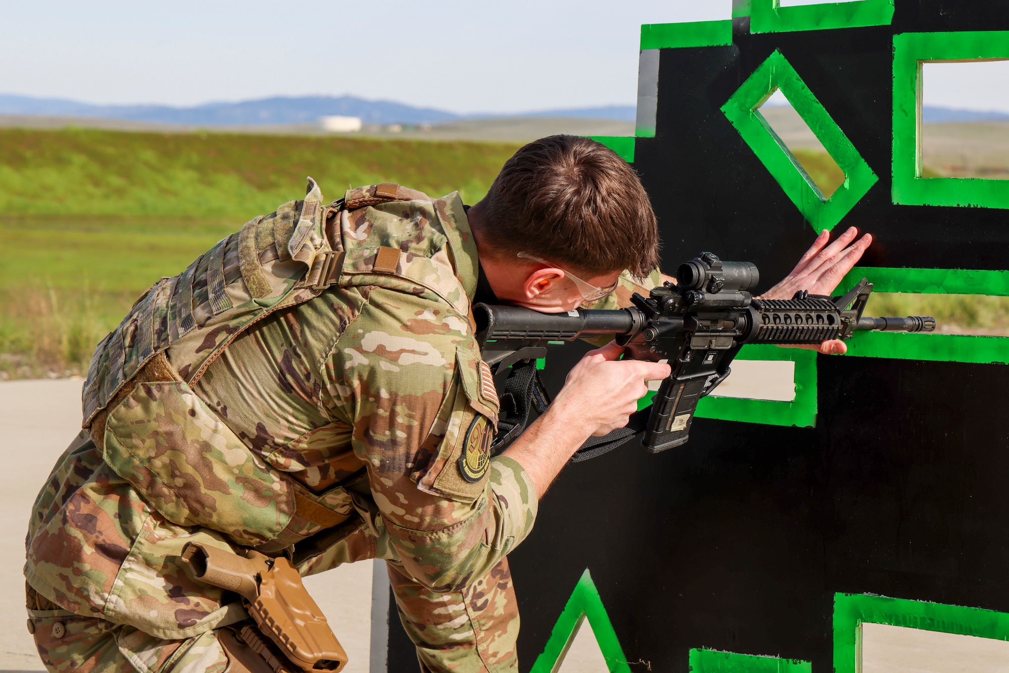 U.S. Air Force Senior Airman Noah Appelgren, 9th Reconnaissance Wing command post senior emergency actions controller, fires an M4A1 Carbine during the shooting qualification of the Tactical Response Team (TRT) tryouts Feb. 12, 2024, at Beale Air Force Base, California.