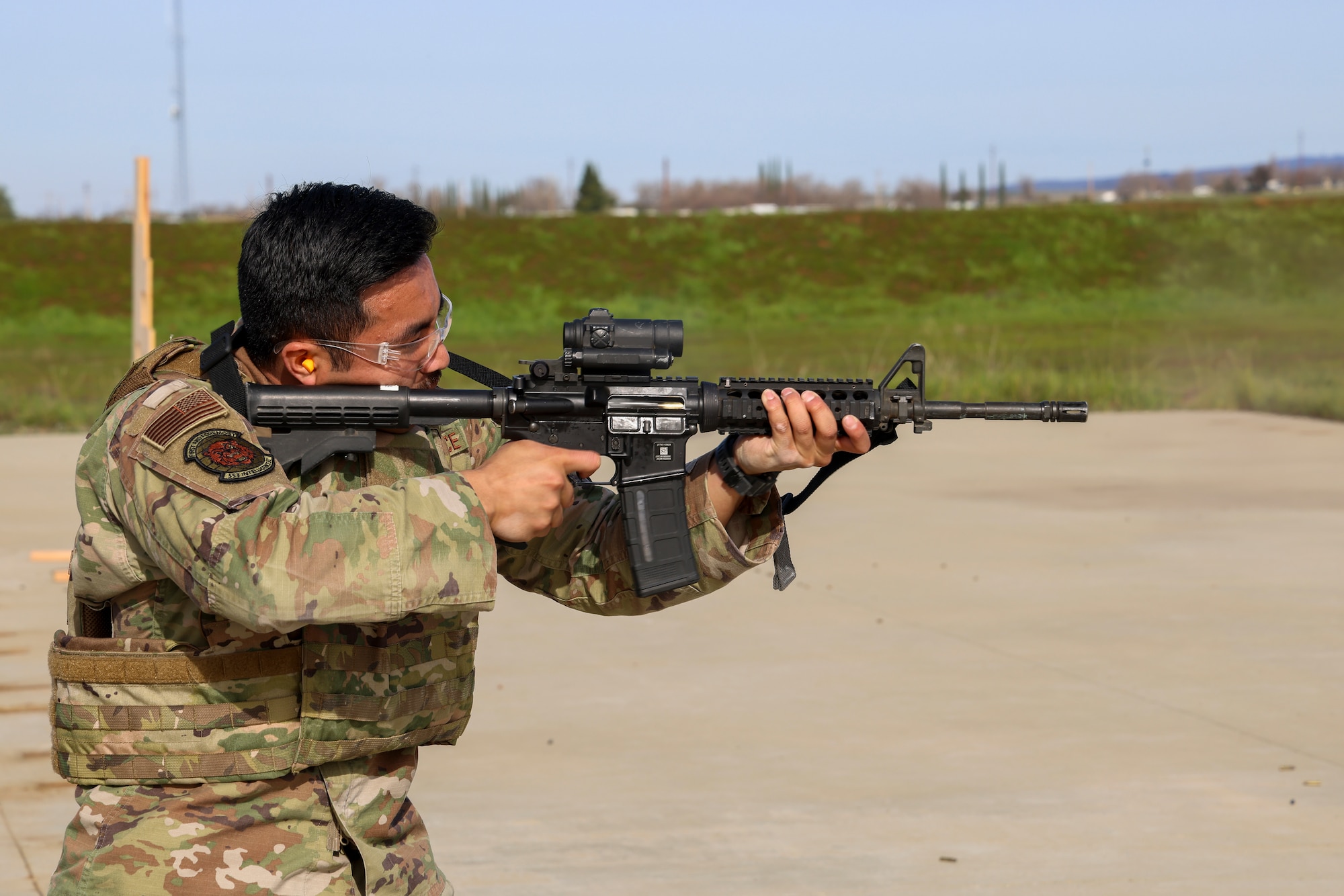 U.S. Air Force Senior Airman Justin Jimenez, 553rd Intelligence Squadron all source analyst, fires an M4A1 Carbine during the shooting qualification of the Tactical Response Team (TRT) tryouts Feb. 12, 2024, at Beale Air Force Base, California.
