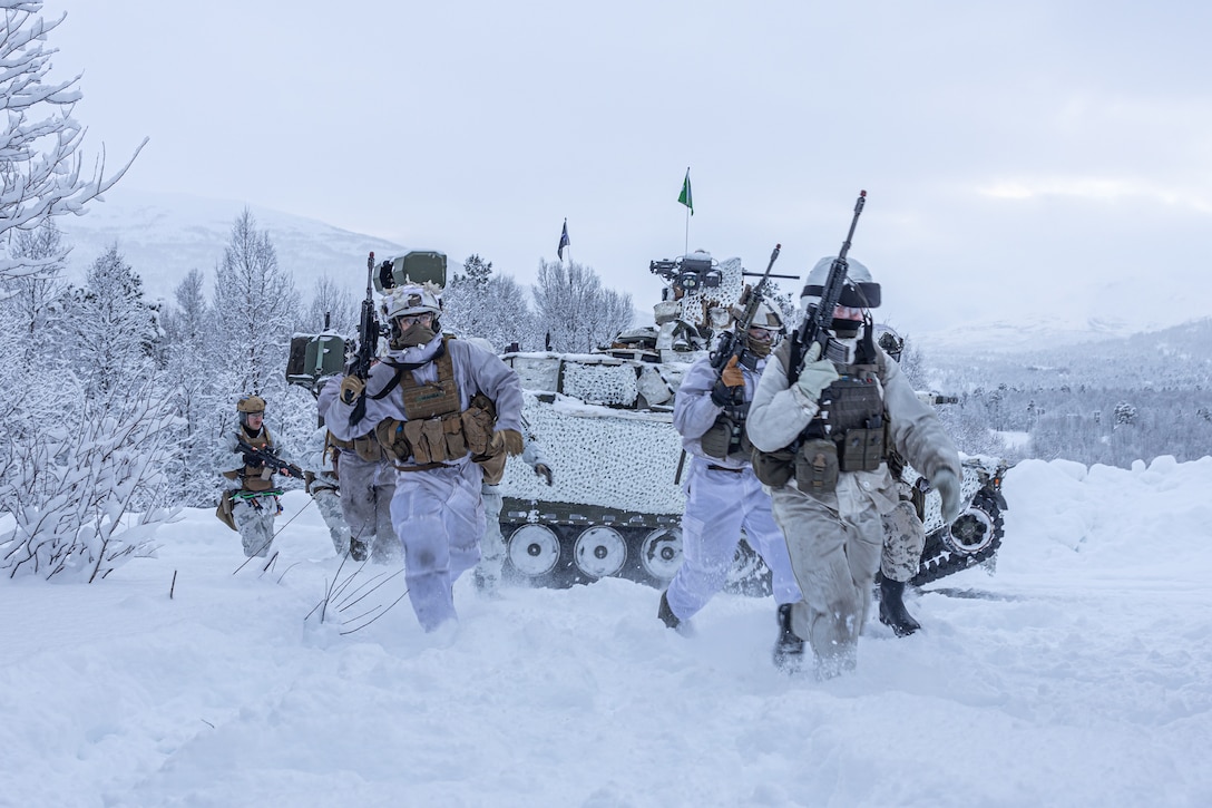 U.S. Marines, alongside NATO allies and partners, strategically advance, securing cover and providing fire support during a breaching and clearing mission in preparation for Nordic Response 24 in Setermoen, Norway, on Feb. 7, 2024. U.S. Marines, in coordination with NATO allies and partners, are gearing up for the biennial exercise Nordic Response 24. This NATO training exercise aims to enhance Arctic security, elevate global readiness, and foster interoperability among U.S. Forces, Allied, and partner forces. (U.S. Marine Corps photo by Lance. Cpl. Christian Salazar)