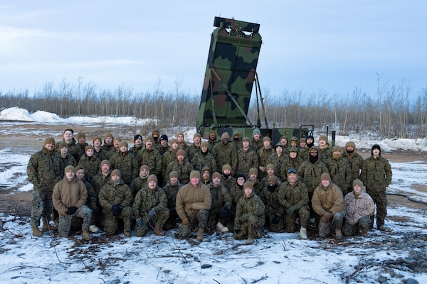 U.S. Marine Corps Col. Ryan P. Allen, Commanding Officer, Marine Air Control Group 48, 4th Marine Aircraft Wing, Marine Forces Reserve, poses for a group photo with Marines with Marine Air Control Squadron (MACS) 24 at Fort Greely, Alaska, Feb. 10, 2024, in preparation for exercise ARCTIC EDGE 2024 (AE24). “Joint training opportunities like Arctic Edge 24 allow the Marines to cultivate proficiency and lethality, while developing the skills necessary to operate in the arctic environment,,” said Allen. AE24 is a U.S. Northern Command-led homeland defense exercise demonstrating the U.S. Military's capabilities in extreme cold weather, joint force readiness, and U.S. military commitment to mutual strategic security interests in the Arctic region. (U.S. Marine Corps photo by Staff Sgt. Jestin Costa)