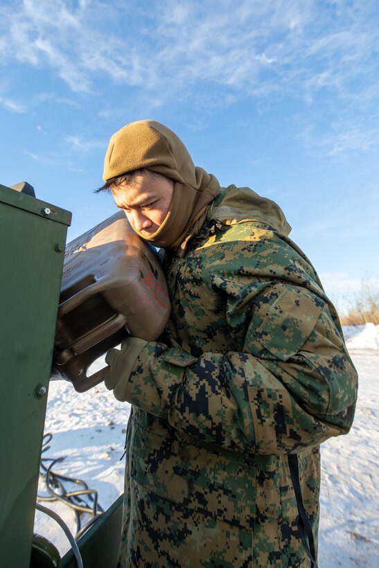 U.S. Marine Corps Lance Cpl. Kenneth Garcia, a generator operator with Marine Air Control Squadron (MACS) 24, Marine Air Control Group 48, 4th Marine Aircraft Wing, Marine Forces Reserve, performs preventative maintenance on a mobile electric power (MEP) 1070 generator at Fort Greely, Alaska, Feb. 10, 2024, in preparation for exercise ARCTIC EDGE 2024 (AE24). The MEP-1070 served a crucial part in supplying power to the AN/TPS-80 (Ground/Air Task Oriented Radar) which provided task-oriented radar picture and command and control function in support of operations in an arctic environment. AE24 is a U.S. Northern Command-led homeland defense exercise demonstrating the U.S. Military's capabilities in extreme cold weather, joint force readiness, and U.S. military commitment to mutual strategic security interests in the Arctic region. Garcia is from Norfolk, Va. (U.S. Marine Corps photo by Staff Sgt. Jestin Costa)