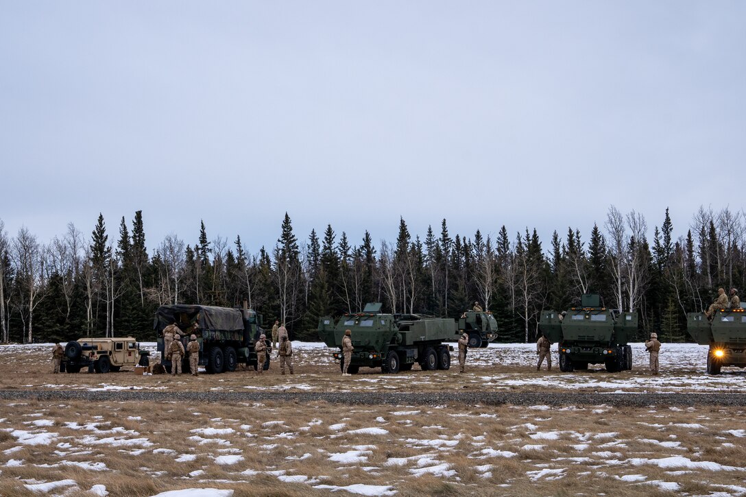 U.S. Marine Corps and U.S. Army service members conduct joint High Mobility Artillery Rocket System (HIMARS) drills in preparation of exercise Arctic Edge 2024 in Fort Greely, Alaska, Feb. 18, 2024. The HIMARS weapon system is a highly mobile artillery rocket system that fires six guided missiles in quick succession. ARCTIC EDGE 2024 (AE24) is a U.S. Northern Command-led homeland defense exercise demonstrating the U.S. military’s capabilities in extreme cold weather, joint force readiness, and U.S. military commitment to mutual strategic security interests in the Arctic region. (U.S. Marine Corps photo by Lance Cpl. Kanoa Thomas).