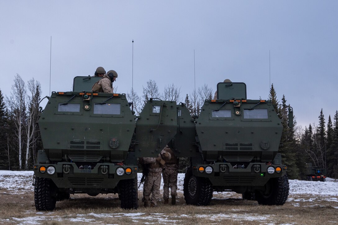 U.S. Marines with Fox Battery, 2nd Battalion, 14th Marine Regiment, 4th Marine Division, Marine Forces Reserve, conduct High Mobility Artillery Rocket System maintenance during joint-performance drills in preparation of exercise Arctic Edge 2024 in Fort Greely, Alaska, Feb. 18, 2024. The HIMARS weapon system is a highly mobile artillery rocket system that fires six guided missiles in quick succession. ARCTIC EDGE 2024 (AE24) is a U.S. Northern Command-led homeland defense exercise demonstrating the U.S. military’s capabilities in extreme cold weather, joint force readiness, and U.S. military commitment to mutual strategic security interests in the Arctic region. (U.S. Marine Corps photo by Lance Cpl. Kanoa Thomas).