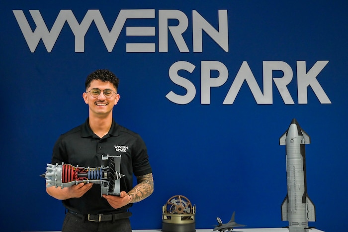 An airman poses for s a photo.