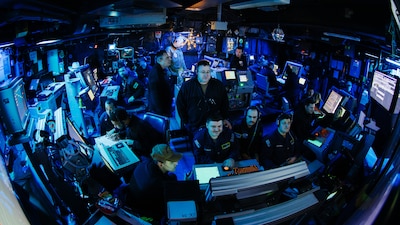Sailors stand watch in the air traffic control center aboard USS George Washington (CVN 73) in the Atlantic Ocean.