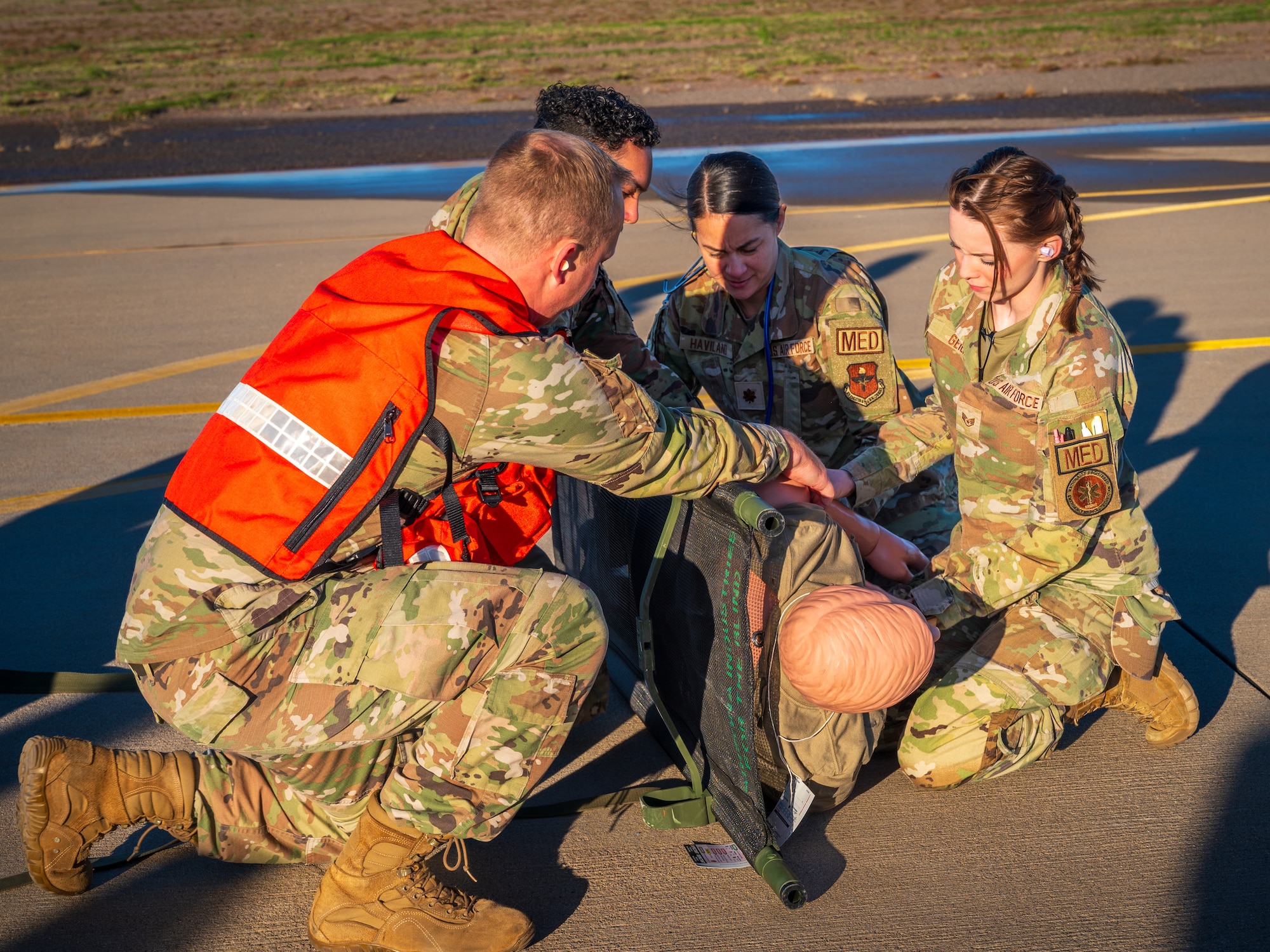 U.S. Air Force Airmen assigned to the 56th Medical Group, simulate transporting a patient on a gurney during a mass casualty exercise, Feb. 21, 2024, at Luke Air Force Base, Arizona.