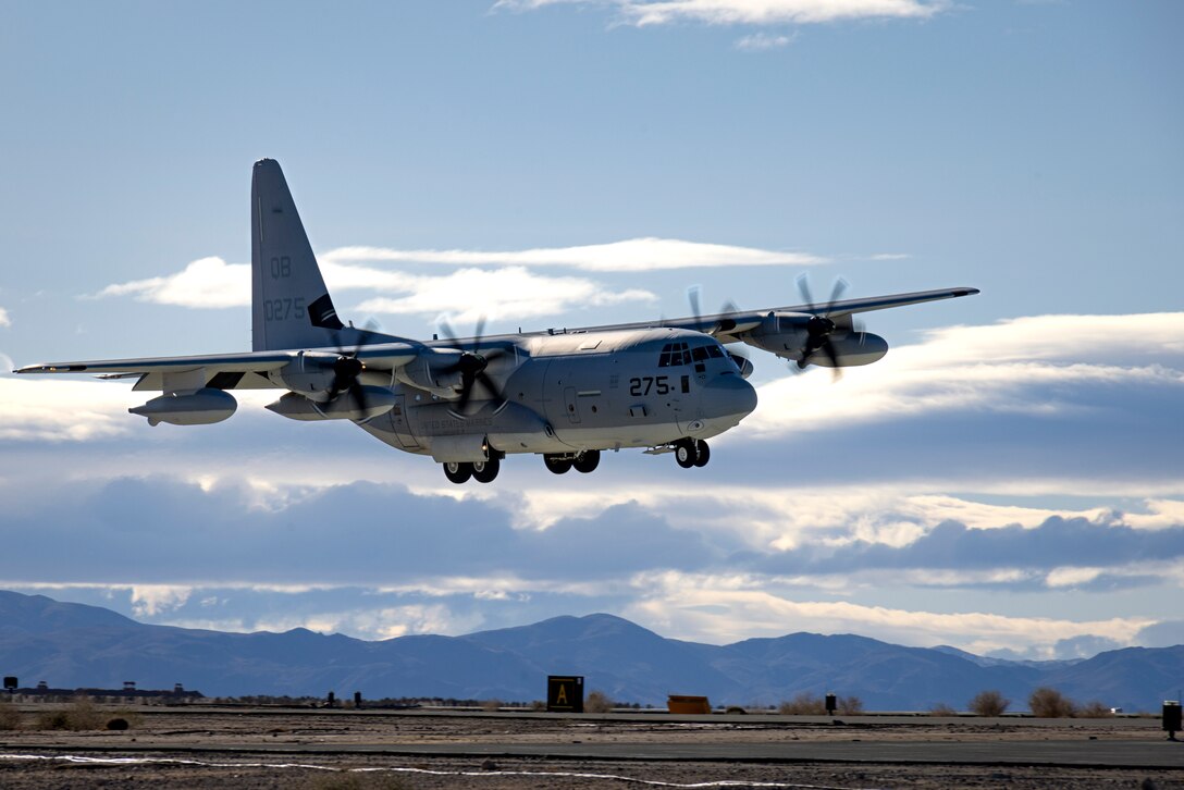 A U.S. Marine Corps KC-130J Hercules assigned to Marine Aerial Refueler Transport Squadron (VMGR) 352, Marine Aircraft Group 11, 3rd Marine Aircraft Wing, lands to execute a High Mobility Artillery Rocket System Rapid Infiltration with 1st Battalion, 11th Marines, 1st Marine Division, during Integrated Training Exercise 2-24, at the Strategic Expeditionary Landing Field, Marine Corps Air-Ground Combat Center Twentynine Palms, California, Feb. 10, 2024. The HIRAIN exercise demonstrated I Marine Expeditionary Force’s ability to rapidly deploy the HIMARS to meet and deter any threats. ITX ensures units are ready to “fight tonight” as a I MEF Marine Air-Ground task force. (U.S. Marine Corps photo by Lance Cpl. Jackson Rush)