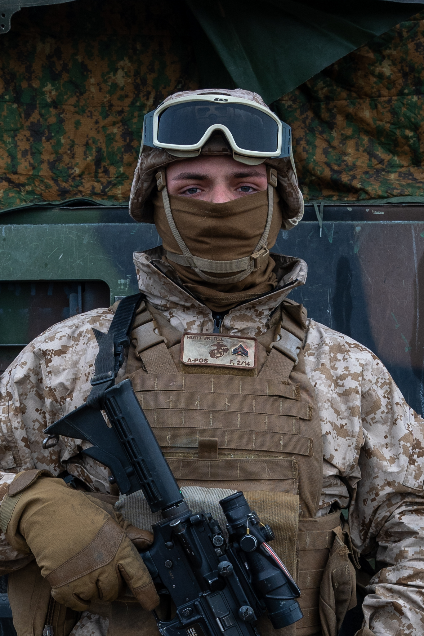 U.S. Marine Corps Cpl. Randall Hurt, a motor transport operator with Fox Battery, 2nd Battalion, 14th Marine Regiment, 4th Marine Division, Marine Forces Reserve, poses for a portrait during joint High Mobility Artillery Rocket System drills in preparation of exercise Arctic Edge 2024 in Fort Greely, Alaska, Feb. 18, 2024. Motor transport operators manage and transport heavy motor tactical vehicles. ARCTIC EDGE 2024 (AE24) is a U.S. Northern Command-led homeland defense exercise demonstrating the U.S. military’s capabilities in extreme cold weather, joint force readiness, and U.S. military commitment to mutual strategic security interests in the Arctic region. (U.S. Marine Corps photo by Lance Cpl. Kanoa Thomas).