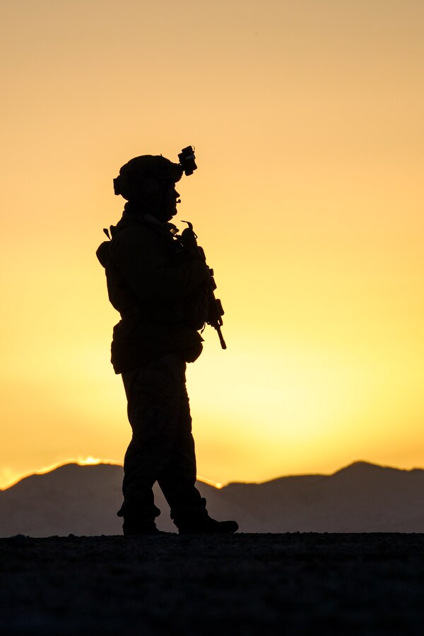 U.S. Marines with 1st Marine Reconnaissance Battalion, 1st Marine Division, await transport with an ultra-light tactical vehicle, during Marine Air-Ground Task Force Distributed Exercise (MDMX) at the Marine Corps Air-Ground Combat Center, Twentynine Palms, California, Feb. 10, 2024. The Marines with 1st Recon began MDMX by conducting a tactical night insertion into an austere environment. MDMX is a maneuver exercise that incorporates ground, air, and logistics operations over several days. (U.S. Marine Corps photo by Sgt. Sean Potter)