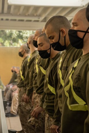 U.S. Marine Corps recruits with Kilo Company, 3rd Recruit Training Battalion, stand by for a medical examination as part of the receiving process at Marine Corps Recruit Depot San Diego, California, Feb. 13, 2024. During receiving week recruits go through administrative and medical processing to ensure training and operational readiness. (U.S. Marine Corps photo by Lance Cpl. Janell B. Alvarez)