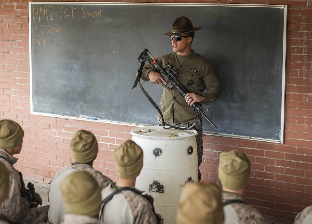 Recruits with Fox Company, 2nd Recruit Training Battalion, receive coaching during grass week on Marine Corps Recruit Depot Parris Island, S.C., Jan. 22, 2024. At the conclusion of grass week, recruits are tested on their knowledge of weapon safety and the fundamentals of marksmanship. (U.S. Marine Corps photo by Lance Cpl. Ava Alegria)