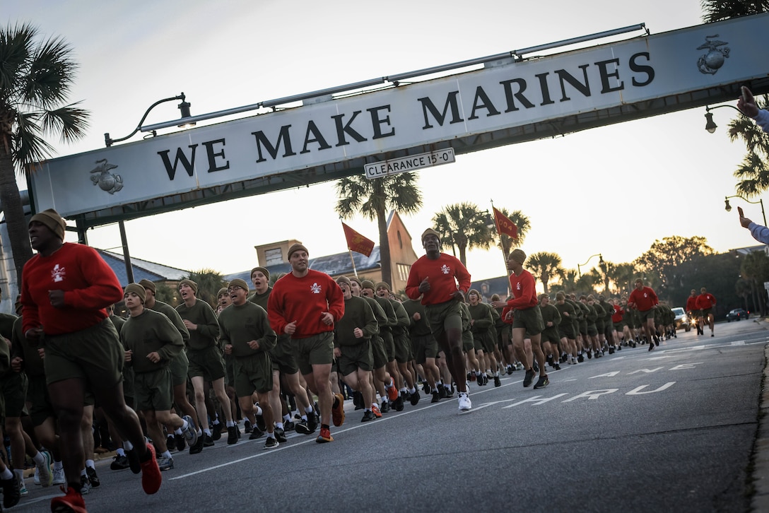 New Marines with Alpha Company, 1st Recruit Training Battalion, participate in the motivational run on Marine Corps Recruit Depot Parris Island, S.C., Jan. 1, 2024. The motivational run takes place on Family Day, the day before graduation, and serves as a first time for visiting families to see their new Marines. (U.S. Marine Corps photo by Lance Cpl. Ava Alegria)