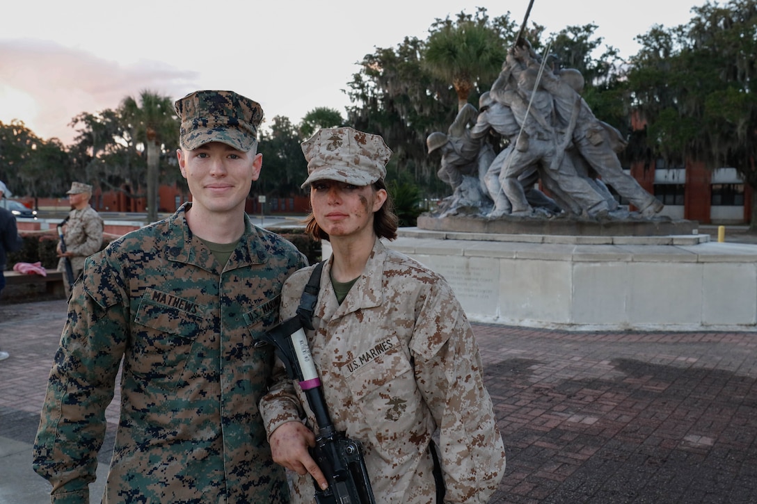 Pfc. Morgan Mathews is awarded her Eagle, Globe, and Anchor from her husband and recruiter SSgt. Charles Mathews at Marine Corps Recruit Depot Parris Island, S.C., Dec. 9, 2023. The EGA ceremony is one of the most important events in any Marine's life, rarely is there an opportunity for a spouse to present a new Marine with the EGA. This moment was so emotionally impactful that neither party could barely say a word. (U.S. Marine Corps photos by Lance Cpl. William Horsley)