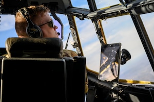 U.S. Air Force 1st Lt. Evin Hamm, a pilot assigned to the 130th Airlift Wing, McLaughlin Air National Guard Base, Charleston, W.Va., looks out of the window over the Mid-Ohio Valley Regional Airport, Williamstown, W.V., on Feb. 8, 2024. The 130th Airlift Wing performs tactical training throughout the state of West Virginia. (U.S. Air National Guard photo by 2nd Lt. De-Juan Haley)