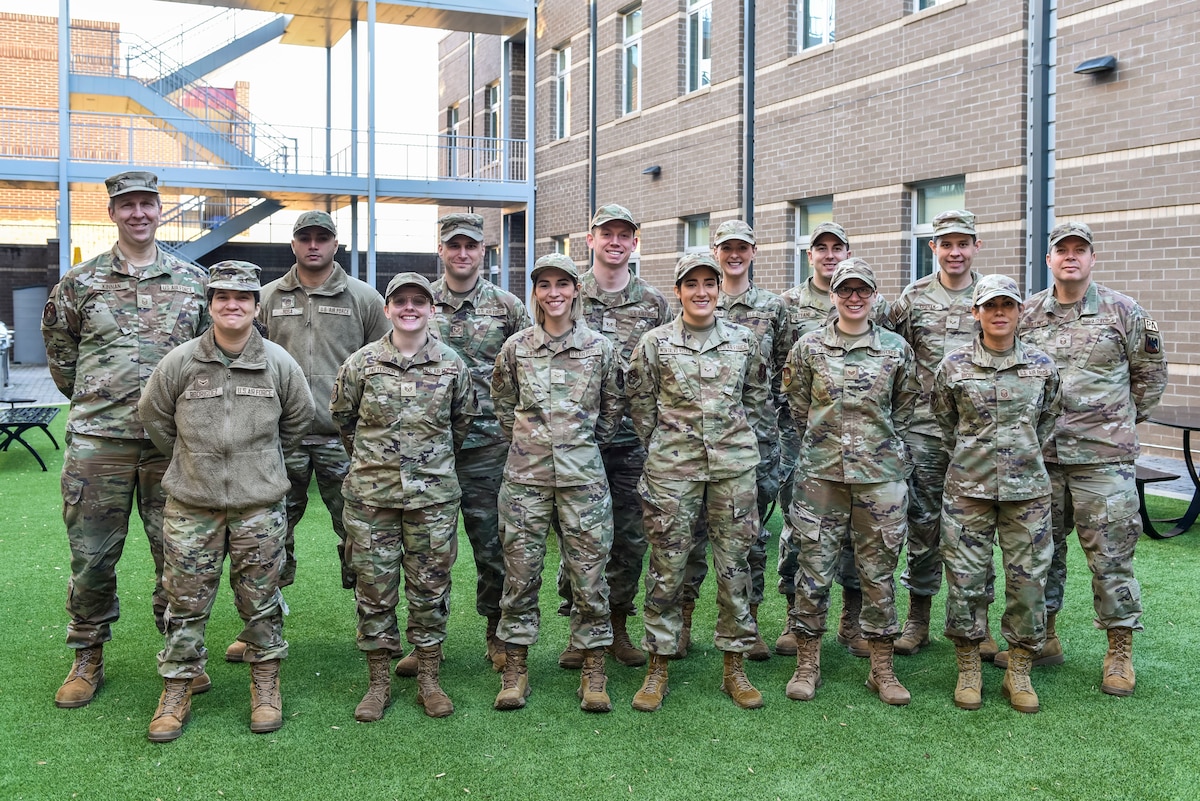 U.S. Air Force Airmen pose for a photo during the Basics of Adobe After Effects course, February 14,2024, at McGhee Tyson Air National Guard Base, Tennessee.