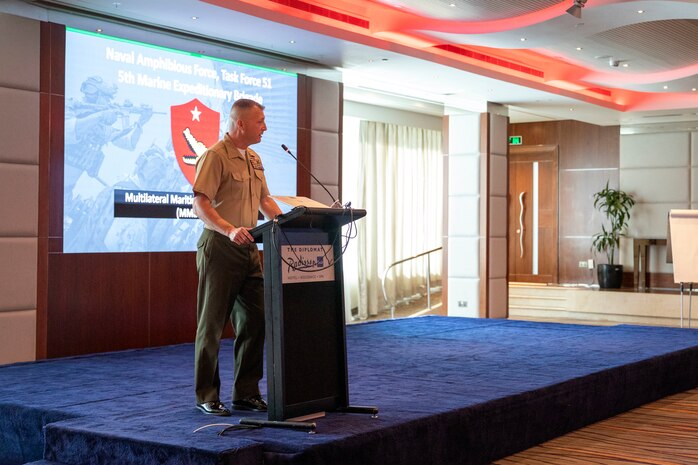 MANAMA, Bahrain (Feb. 21, 2024) U.S. Marine Brig. Gen. Matthew Reid, commanding general of Task Force 51/5th Marine Expeditionary Brigade (TF 51/5), gives his opening remarks during the Multilateral Maritime Engagement (MME) 24.1 in Bahrain, Feb. 21. MME 24.1 signifies the commitment of TF 51/5 and its regional partners to ensure stability, enhance regional opportunities, and build partnerships that can effectively respond to dynamic crises. This conference serves as a testament to the dedication and cooperation among the participating nations, highlighting their shared goal of promoting regional stability and security. (U.S. Marine Corps photo)