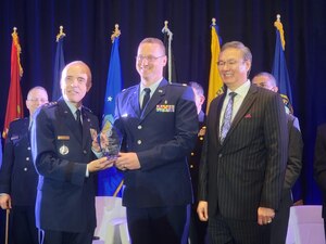 30th Medical Group diagnostics and therapeutics flight commander, receives the Association of Military Surgeons of the United States Premier Innovation Award at Gaylord National Harbor Resort and Convention Center in National Harbor, Md.