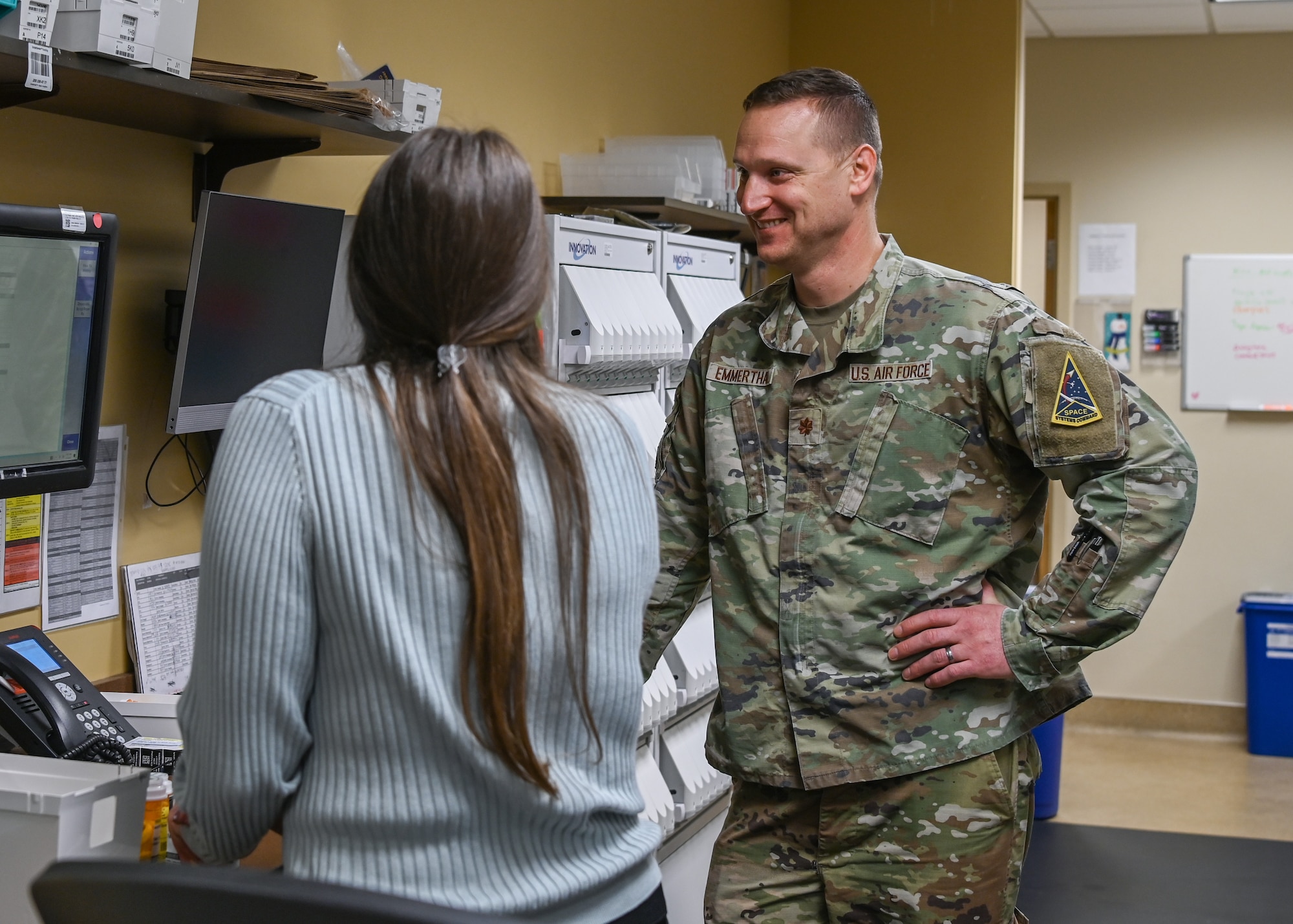 30th Medical Group diagnostics and therapeutics flight commander, works with a colleague to fill prescriptions at the 30th Medical Group pharmacy at Vandenberg Space Force Base.