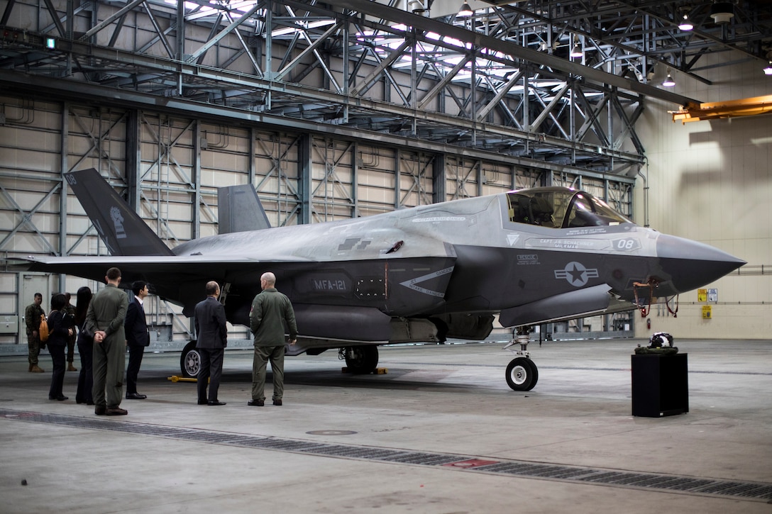 Japanese members of the Status of U.S. Forces Agreement Division, Ministry of Foreign Affairs, and Bureau of Policies for Regional Society, Ministry of Defense, tour an F-35B Lightning II aircraft with Marine Fighter Attack Squadron (VMFA) 121 at Marine Corps Air Station Iwakuni, Japan, Feb. 14, 2024. The Japan Ministry of Foreign Affairs and Ministry of Defense representatives visited a static display of VMFA-121’s F-35B Lightning II aircraft to learn about 5th generation stealth aircraft capabilities and enhance partnership in the Indo-Pacific region. (U.S. Marine Corps photo by Cpl. Samantha Rodriguez)