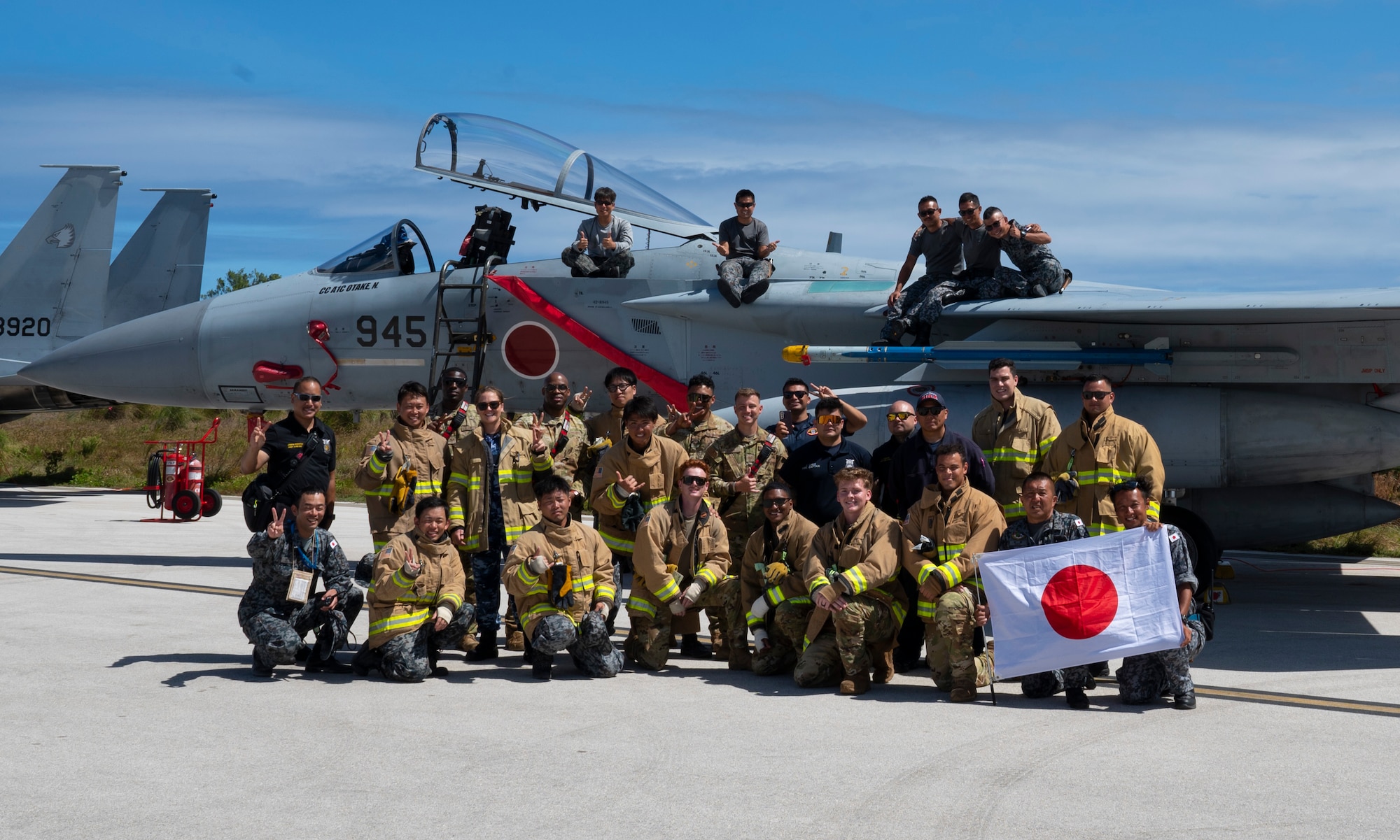 Members of the U.S. Air Force, Japan Air Self-Defense Force and Royal Australian Air Force pose for a photo during Cope North 24 on Pacific Regional Training Center-Andersen, Feb. 14, 2024. Cope North enhances U.S. relationships and interoperability with our regional Allies and partners by providing the opportunity to exchange information and improve shared tactics to better integrate multilateral defense capabilities. (U.S. Air Force photo by Airman 1st Class Spencer Perkins)